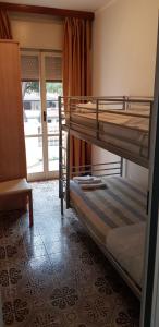 Postel nebo postele na pokoji v ubytování Hotel Enrica
