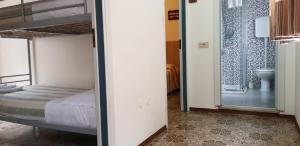 Postel nebo postele na pokoji v ubytování Hotel Enrica