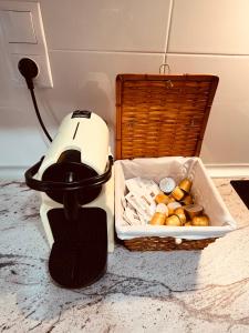 a blender sitting on a counter next to a basket of food at Apartamento en Salou in Salou +40 photos