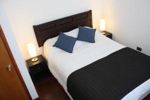 Cama o camas de una habitación en Hostal Buró