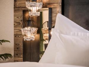 A bed or beds in a room at Aparthotel Stacherhof