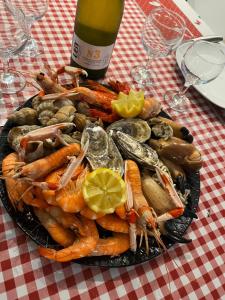 a plate of seafood and vegetables on a table at Chez Rose in Ault +7 photos