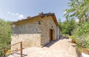an external view of a stone building with a door at 2 Bedroom Stunning Home In Casoli Lu in Cocciglia