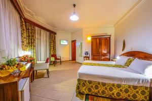 Ein Bett oder Betten in einem Zimmer der Unterkunft Hotel Chez Lando