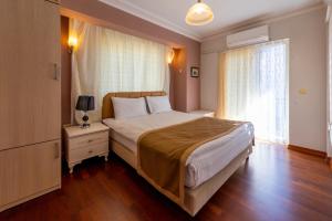Vira Suites Hotel客房内的一张或多张床位