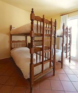 A bed or beds in a room at Plaza Andalucía Edificio Enebro 4-6 pax