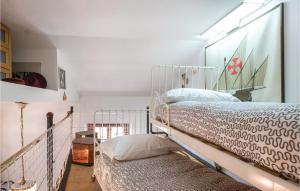 מיטה או מיטות בחדר ב-Il Cottage