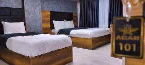 Ένα ή περισσότερα κρεβάτια σε δωμάτιο στο Acar Airport Hotel Plus