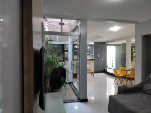 a living room with a couch and a dining room at Casa Porto Di Nassau in Porto Seguro