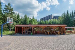 a pavilion with a basketball hoop in a park at Pensiunea Orizont in Poiana Brasov