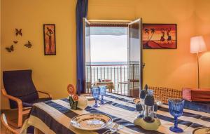 a dining room with a table with a view of the ocean at Donna Mariangela in Caronia Marina