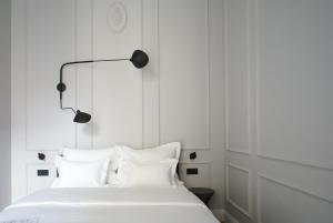 Säng eller sängar i ett rum på Fingerprint Luxury Apartments 3