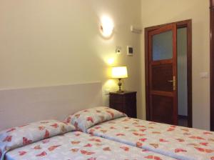 Voodi või voodid majutusasutuse Cadorna Chalet toas