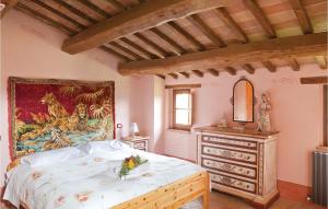 A bed or beds in a room at Podere Giovannini