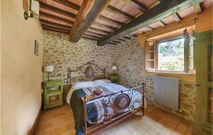 A bed or beds in a room at Podere Giovannini
