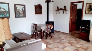 a living room with a table and a couch at Stone Cottage FINISTERRE in Curtis