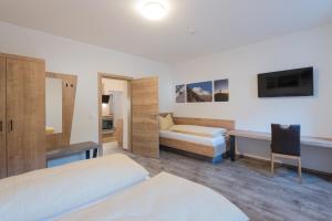Postel nebo postele na pokoji v ubytování Ferienwohnungen Appartementhaus Hohe Tauern
