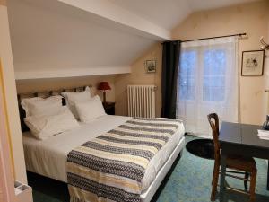 Postel nebo postele na pokoji v ubytování Le Chalet Montégut