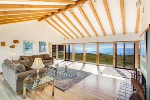 a living room with a lot of windows at Seascape in Sea Ranch