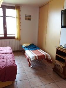 Postel nebo postele na pokoji v ubytování Au Pichet