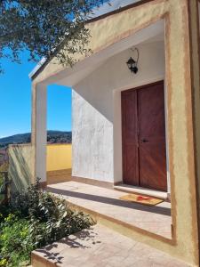a door to a house with a view of a field at Martina's Place (with panoramic views) in Chia