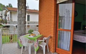 a patio with a table and chairs on a balcony at Le Rocche 1 in Cisterna dʼAsti