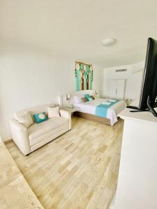 TV a/nebo společenská místnost v ubytování Cyan Cancun Resort & Spa