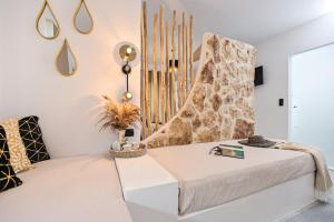 Кровать или кровати в номере Casa Verde Di Naxos