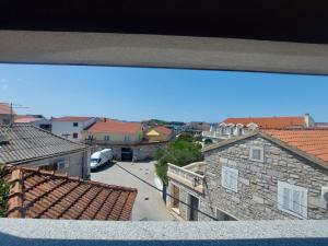 a view from a balcony of a city with buildings at Apartments Božena in Pakoštane