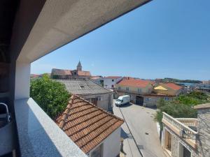 a view of a city street from a balcony at Apartments Božena in Pakoštane