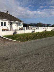 a house on the side of a road at Skerrols in Broadford