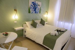 Postel nebo postele na pokoji v ubytování Corallo Rosso B&B