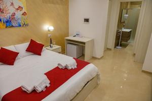 Postel nebo postele na pokoji v ubytování Corallo Rosso B&B