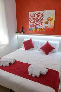Postel nebo postele na pokoji v ubytování Corallo Rosso B&B