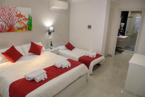 Postel nebo postele na pokoji v ubytování Corallo Rosso B&B