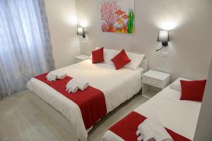Postel nebo postele na pokoji v ubytování Corallo Rosso B&B
