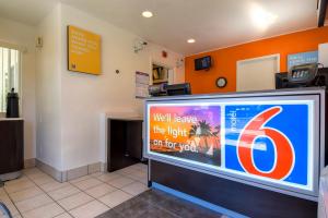 a waiting room with a large sign in a waiting area at Motel 6-San Diego, CA - North in San Diego