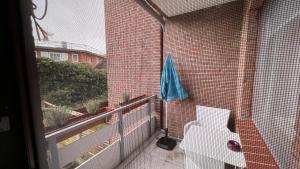 a view of a balcony with a toilet on a building at Travemünde Kleine Perle in Lübeck