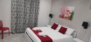 Postel nebo postele na pokoji v ubytování Corallo Rosso B&B
