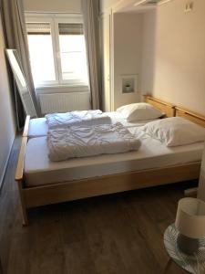 Ένα ή περισσότερα κρεβάτια σε δωμάτιο στο Appartement Westende - Ariane 001