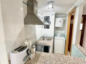 Kuchyň nebo kuchyňský kout v ubytování Payma Apartments Benidorm