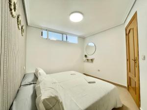 Postel nebo postele na pokoji v ubytování Payma Apartments Benidorm