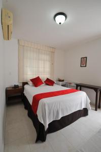 Postel nebo postele na pokoji v ubytování Hotel San Julian