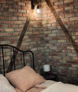 A bed or beds in a room at Mátrai Vadászház 3-Vintage Cottage