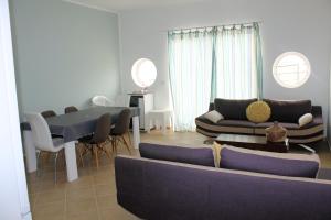 a living room with a couch and a table at African Sunset in Sal Rei