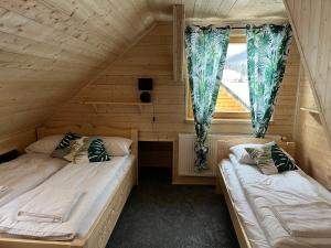 Posteľ alebo postele v izbe v ubytovaní Apartament Jeleń Łoś Niedźwiedź