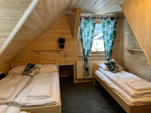 Posteľ alebo postele v izbe v ubytovaní Apartament Jeleń Łoś Niedźwiedź