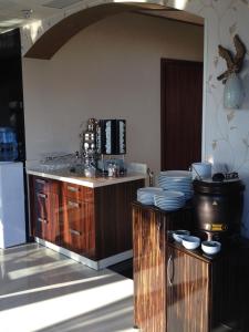 A kitchen or kitchenette at My Liva Hotel