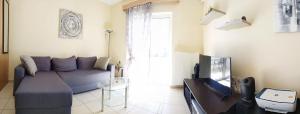 TV a/nebo společenská místnost v ubytování Holiday & Business Furnished Apartments