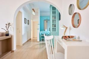 a kitchen with a white counter and a table at Casa Polivios in Adamas